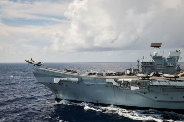 An F-35B Lightning II taking off from HMS Prince of Wales, seen from a Merlin Mk2 Helicopter from 814 NAS embarked onboard RFA Tidespring. The Royal Navy flagship is due to visit Japan soon, with a time period being given.