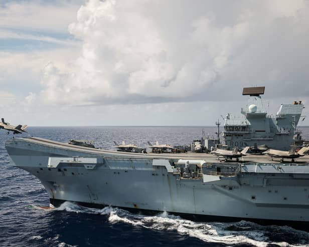 An F-35B Lightning II taking off from HMS Prince of Wales, seen from a Merlin Mk2 Helicopter from 814 NAS embarked onboard RFA Tidespring. The Royal Navy flagship is due to visit Japan soon, with a time period being given.