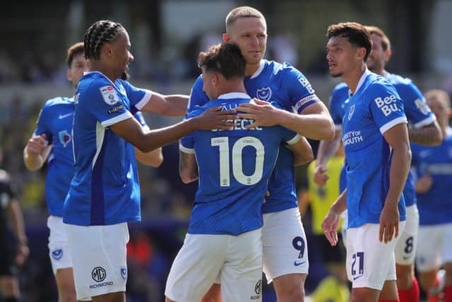 Colby Bishop congratulates Adrian Segecic following his first-half winner against Oxford United at the Kassam Stadium