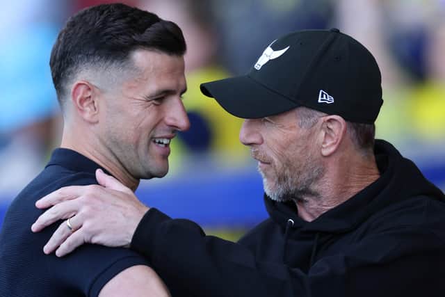 Pompey boss John Mousinho, left, and Oxford boss Gary Rowett