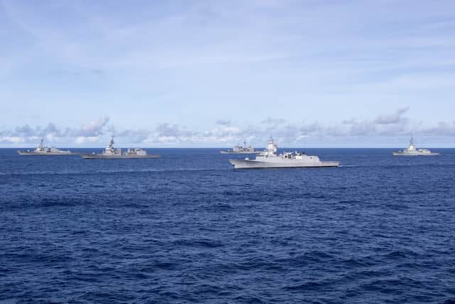 (Left to right) USS Shoup, JS Teruzuki, USS Robert Smalls, HNoMS Roald Amundsen and ESP Mendez Nunez sailing in formation alongside HMS Prince of Wales.