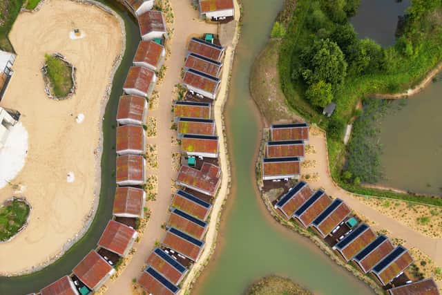 The lodges are built around the giraffe area and a lake