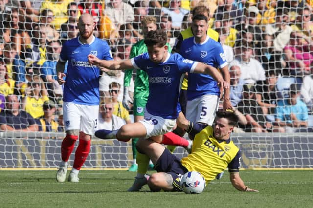 Callum Lang is challenged by Oxford's Tyler Goodrham in last weekend's 1-0 victory at the Kassam Stadium. Picture: Alun Roberts/ProSportsImages