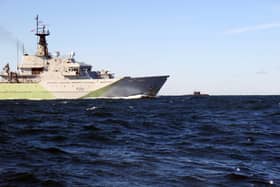 HMS Tyne, a Royal Navy ship based in Portsmouth, has been sent to Scotland while conducting officer training on board. Pictured is the vessel keeping tabs on a surfaced Kilo-class submarine in the Channel.