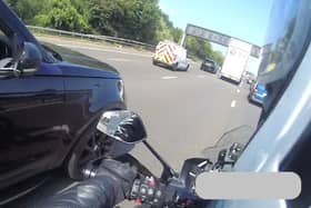 An unmarked police car has spotted a driver on their phone on the A27. 