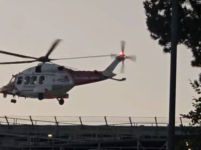 Emergency services including a helicopter was deployed near a boat crash in Tipner. Pictured is the aircraft yesterday near Queen Alexandra Hospital.