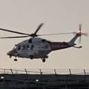 Emergency services including a helicopter was deployed near a boat crash in Tipner. Pictured is the aircraft yesterday near Queen Alexandra Hospital.