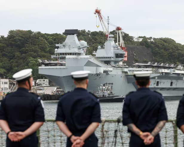 A defence expert has addressed some of the key challenges facing the Royal Navy and defence businesses. Pictured: Members of ships company look on at HMS Prince of Wales as HMS Dauntless arrives in Japan. 