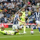 Connor Ogilvie challenges Aune Heggebo in the box on Saturday. Pic: Getty.