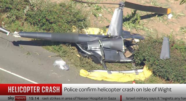Screengrab taken from Sky News of a helicopter that crashed on the Isle of Wight. Emergency services were called to the site near the A3020 Shanklin Road on Monday morning.