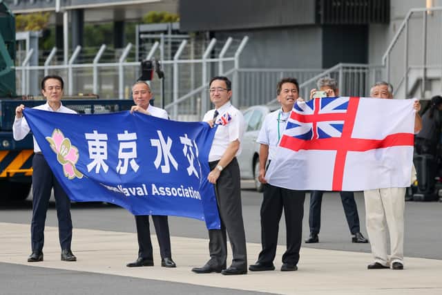 Members of the Royal Naval Association in Japan welcoming HMS Prince of Wales to Tokyo.
