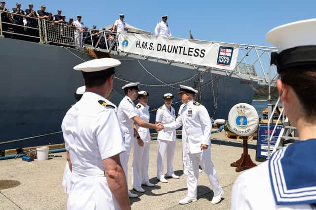 Cdr Dorrington saying goodbye to HMS Dauntless.