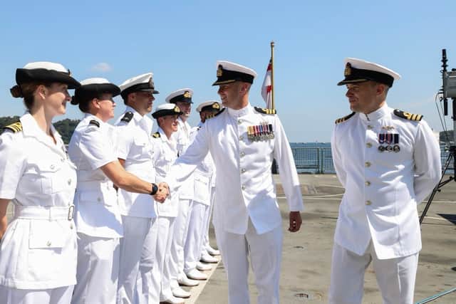 Cdr Skinner meeting members of the wardroom at HMS Dauntless.