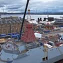 HMS Venturer's foremast has been fitted to the new Type 31 ship which will be based at the Royal Navy base in Portsmouth. An export deal for Type 31s with Denmark is expected to be announced soon.