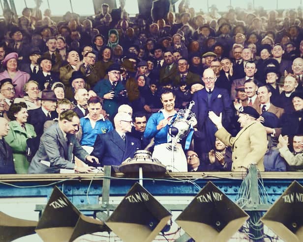 Field Marshall Bernard Montgomery (in beret) presents the first division trophy to Portsmouth FC captain Reg Flewin in the Directors’ Box of the South Stand in April 1949. Portsmouth were champions of England for two seasons in a row, they retained the title in 1950, a feat only achieved by six clubs since World War Two: Wolves, Liverpool, Manchester United, Chelsea and Manchester City are the others. Photographer: Unknown (colorised by Andy Imrie) / Pompey History Society Archive