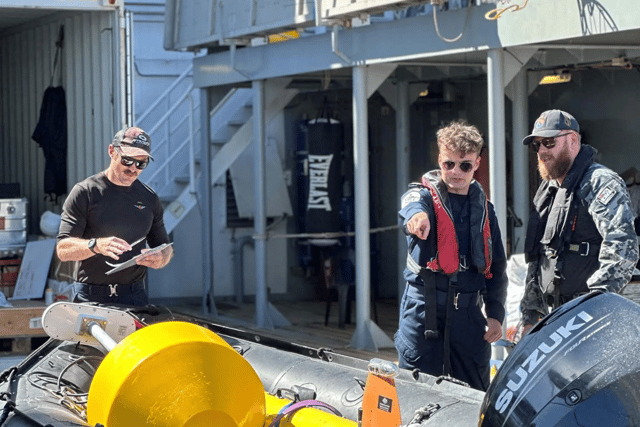 Royal Navy and Australian sailors testing underwater drones.