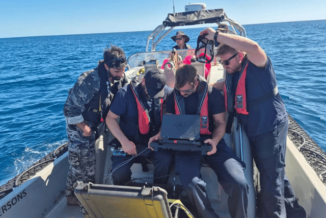 Royal Navy personnel testing futuristic underwater drones that can protect undersea cables from harm. This took place during Exercise Talisman Sabre, which saw HMS Prince of Wales take part in a huge operation.