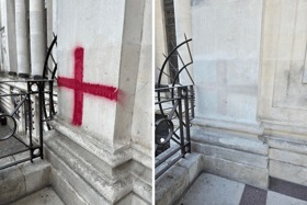 A St George's cross graffitied onto Portsmouth Guildhall has been removed, though some remnants of it remain.