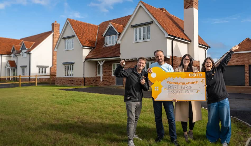 BOTB presenters Christian Williams (right) and Katie Knight (left) with the Robert Everson and his wife Carleane in front of their new dream home