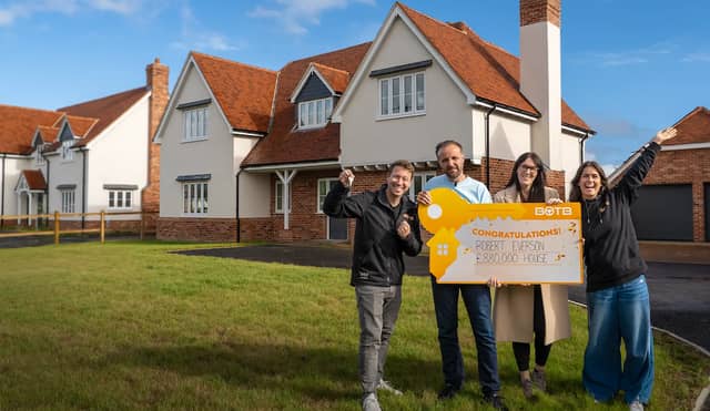 BOTB presenters Christian Williams (right) and Katie Knight (left) with the Robert Everson and his wife Carleane in front of their new dream home