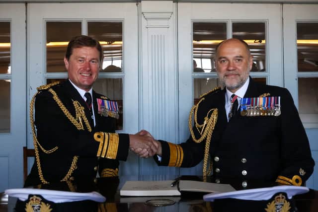 Vice Admiral Andrew Burns, CB, OBE signs over responsibility of Fleet Commander to Vice Admiral Steve Moorhouse in the Admiral's Great Cabin on board HMS Victory. He has a wealth of experience, including roles as Commanding Officer of both aircraft carriers.