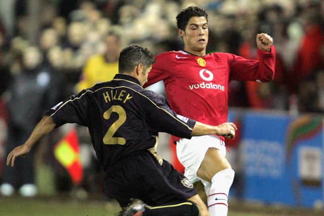 Scott Hiley challenges Cristiano Ronaldo in an FA Cup clash with Manchester United in January 2005. Picture: John Peters/Manchester United via Getty Images