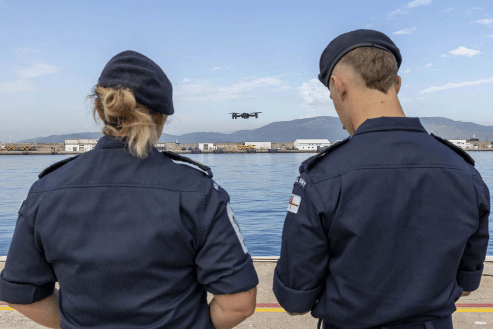 Members of the Gibraltar Squadron flying a drone outside HMNB Gibraltar, with personnel getting to grips with the new UAVs.