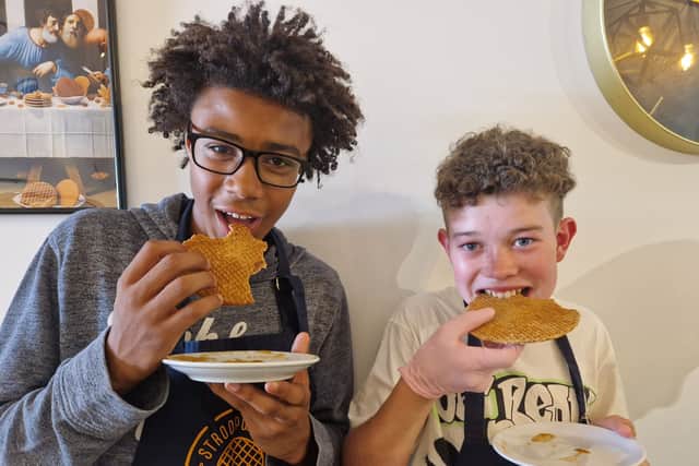 Jaden and George tuck into the stroopwafels they made in Amsterdam