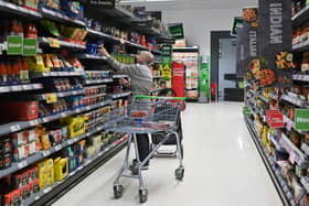 A customer looks at some goods at an Asda supermarket. The retailer has just launched its first-ever fixed-price meal deal for £3.74, with no loyalty card needed (Photo: JUSTIN TALLIS/AFP via Getty Images)