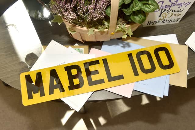 Mabel Kidney celebrated her 100th birthday on Friday, September 19, 2025, at Admiral Jellicoe House in Portsmouth, where she was presented with her War Service Medal. Pictured  is a custom licence plate for her mobility scooter.