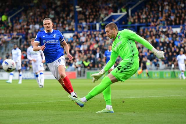 Pompey skipper Colby Bishop attempts to close down Sheffield Wedesday keeper Ethan Horvath. Picture: Jeff Hood
