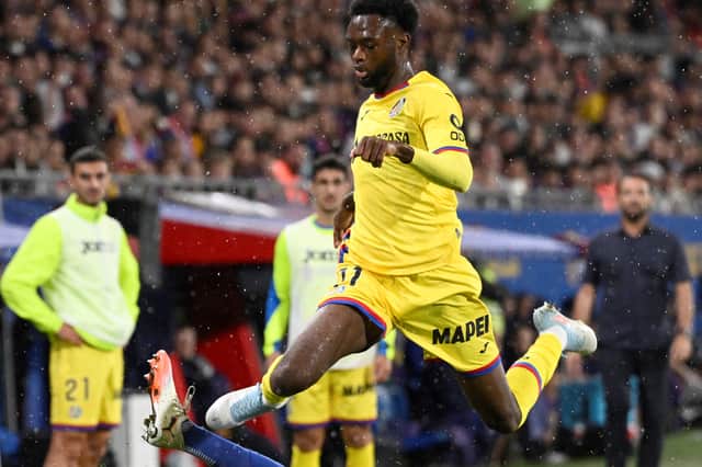 Abu Kamara jumps Barcelona's Gerard Martin in their La Liga clash on Sunday. Picture: Josep LAGO / AFP