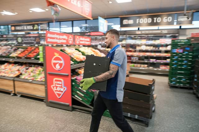 Colleagues at an Aldi store restock the shelves. The supermarket is recruiting 4,500 staff across the UK ahead of the busy Christmas period (Photo: Christopher Furlong/Getty Images)