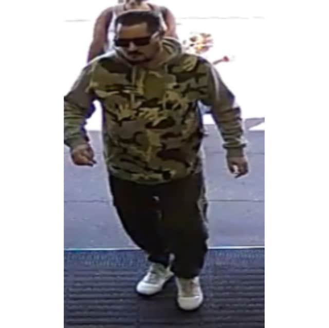 Police have released a CCTV image of a man they want to speak to after a woman's purse was stolen at Farmfoods in Fratton on Tuesday, July 1.