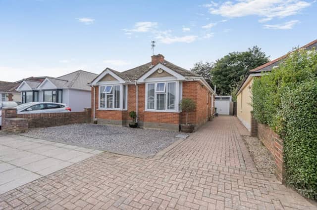 The property has driveway parking and a detached garage