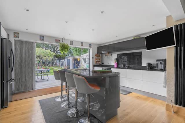 The modern kitchen has fitted appliances