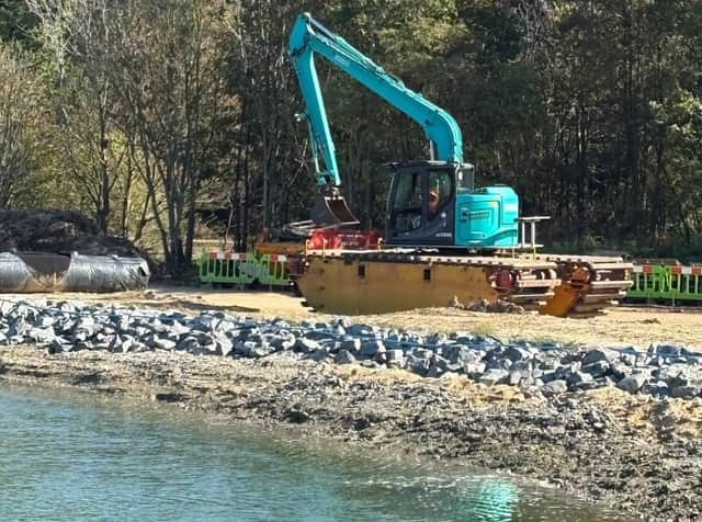 Amphibious excavator - with floating pontoons, able to conduct dredging work in the Hilsea moat