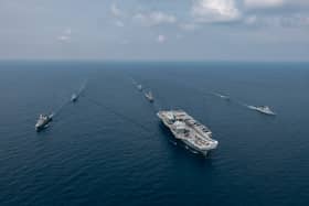 Aerial image of the Carrier Strike Group during Ex BERSAMA LIMA 2025 off the Malaysian coast, with HMS Prince of Wales at the helm.