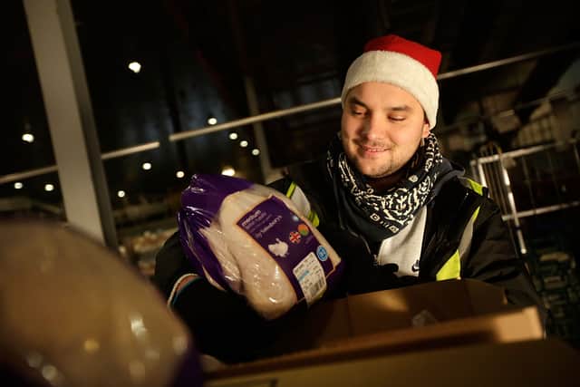 A staff member packs fresh turkeys ready for delivery at Sainsbury's Waltham Point Distribution Centre. Around 19,000 seasonal jobs are being created across one of the UK’s biggest retailers for Christmas (Photo: Matthew Lloyd/Getty Images)