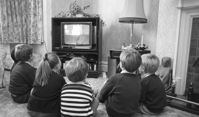 Sitting too close to the TV won't do your eyes any permanent damage