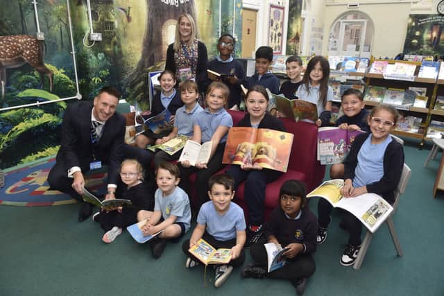 Copnor Primary School in Copnor Road, Portsmouth, has received a positive result in their recent Ofsted report. 

Pictured is: (front left) Matt Johnson, headteacher, and (back left) Lizzie Shackelford, deputy headteacher, with just some of the children at the school.

Picture: Sarah Standing (071025-1149)