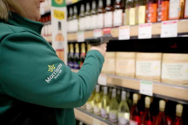 A member of staff scans groceries inside Rochdale's Morrisons supermarket. The retailer has launched Morrisons Now, a one-hour grocery delivery service (Photo: Christopher Furlong/Getty Images)