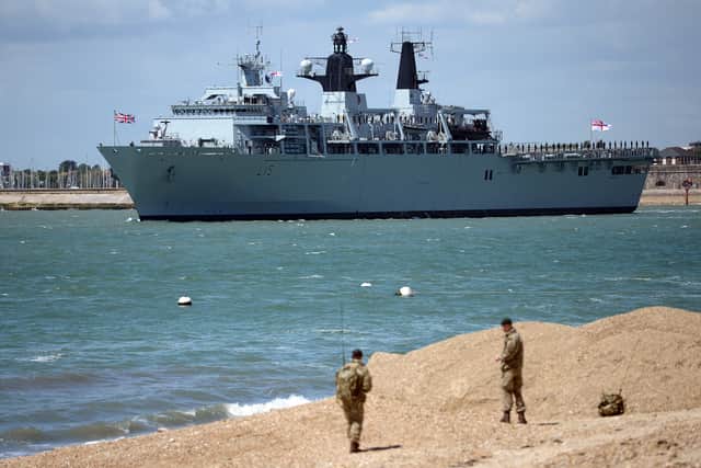 The multi-role strike ship programme has been scrapped in favour of new amphibious transport ships, due to replace HMS Bulwark (pictured) and HMS Albion.
