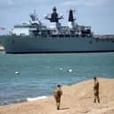 The multi-role strike ship programme has been scrapped in favour of new amphibious transport ships, due to replace HMS Bulwark (pictured) and HMS Albion.