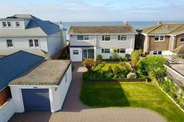 The house sits directly on the shore line