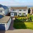 The house sits directly on the shore line