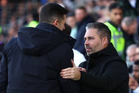 Marti Cifuentes, right, and John Mousinho shake hands ahead of QPR's visit to Pompey last February