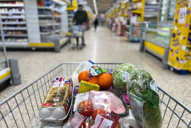 Food items in a shopping trolley inside a Tesco supermarket store. The retailer is hiring over 28,500 temporary staff across the UK for the Christmas period (Photo: DANIEL LEAL/AFP via Getty Images)