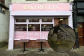 Bakerellys in Queens Street had a window smashed with a CCTV image showing a hooded person on a bike at the time of the incident.