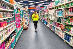 A woman walks in a section of cleaning products in a store of B&M. The retailer has revealed a £7 million accounting error caused by a system upgrade earlier this year (Photo: NICOLAS GUYONNET/Hans Lucas/AFP via Getty Images)          